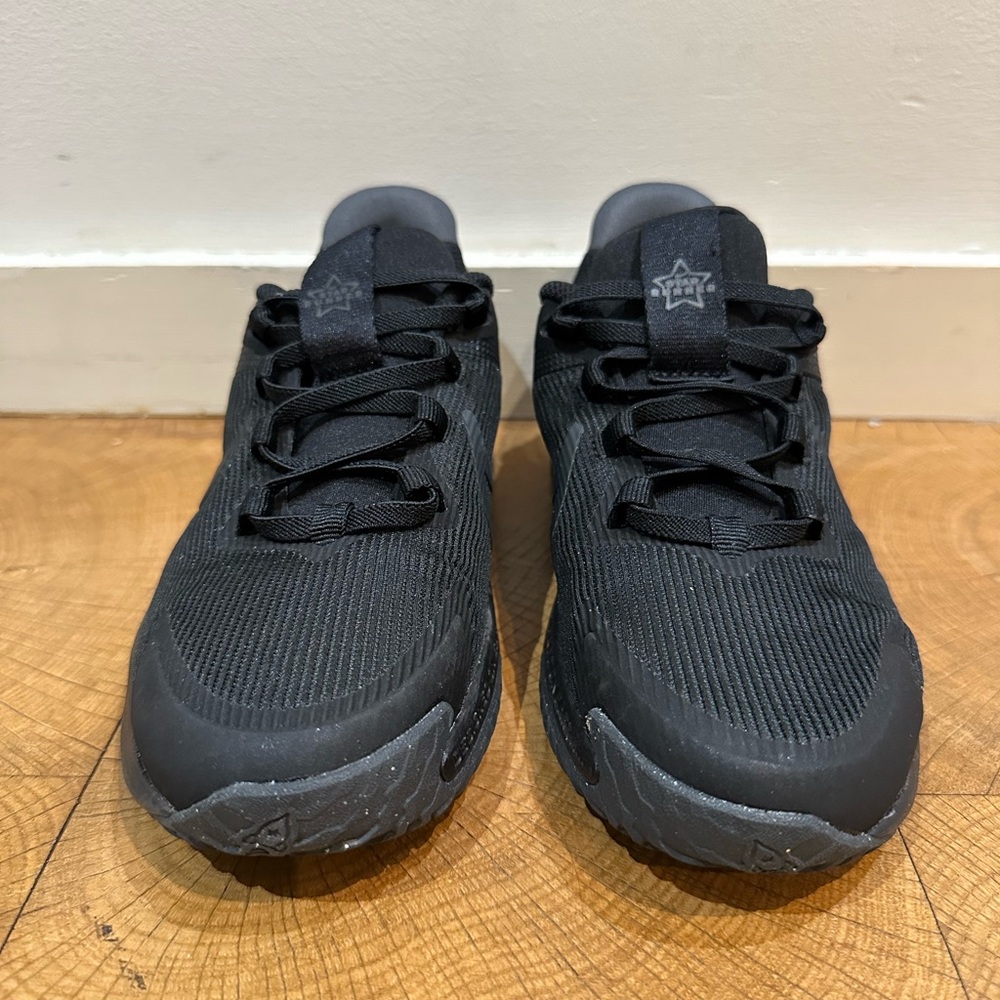 Black Nike kids sneakers.